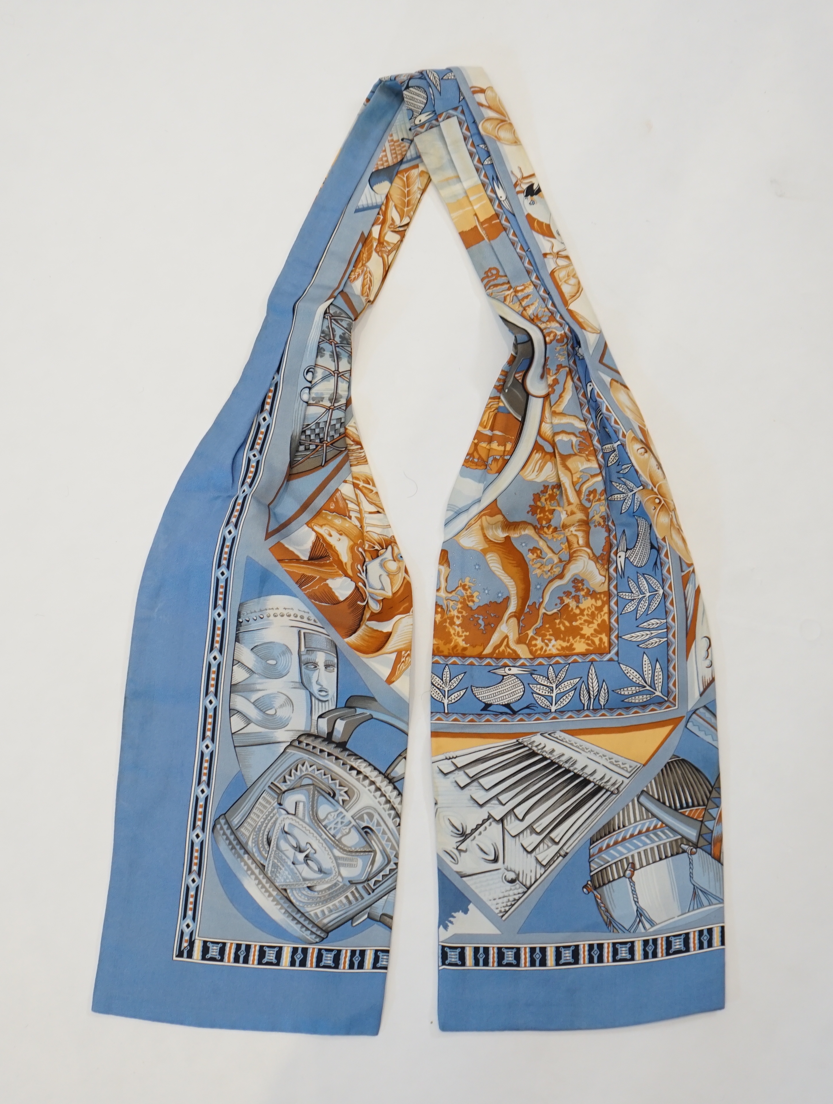 A Hermès silk cravat in ethnographic pattern, length 127cm x 18cm